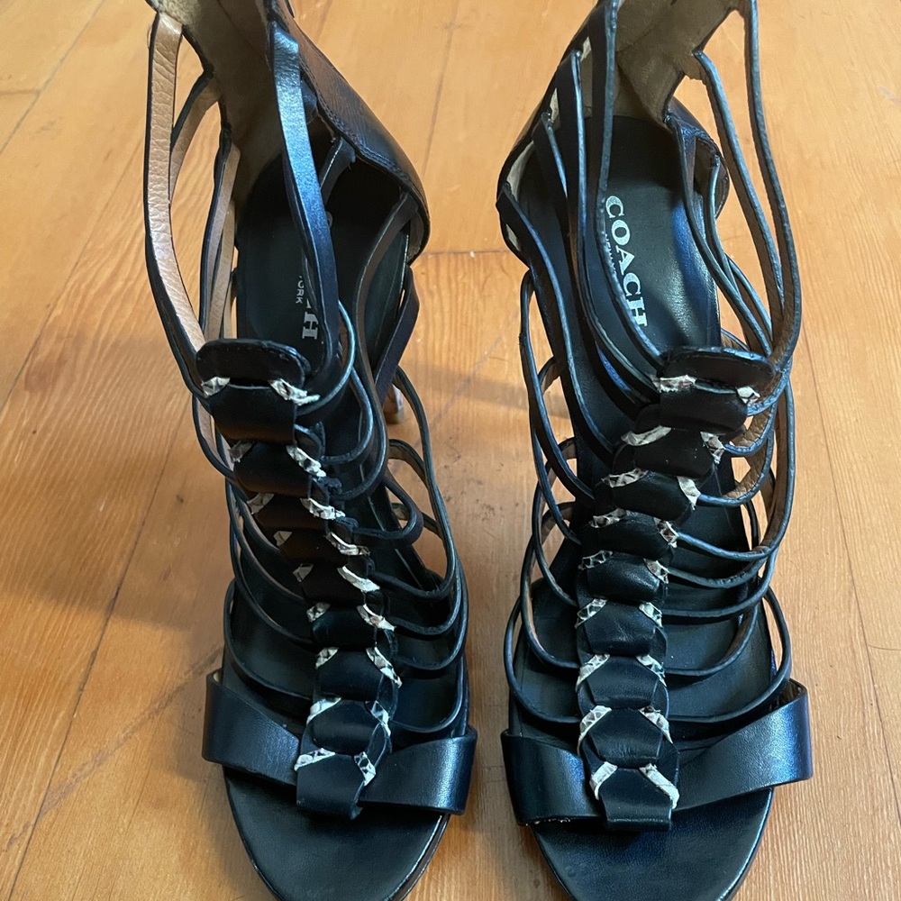 COACH black heals with snakeskin print.